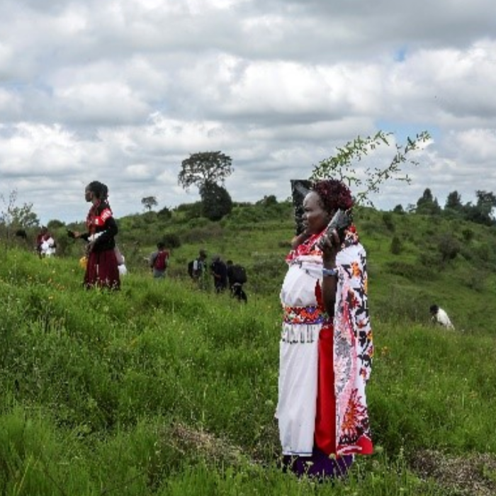 A member of the Paran Women Group at a tree planting site on the slopes of the Mau Forest in Narok County, Kenya.