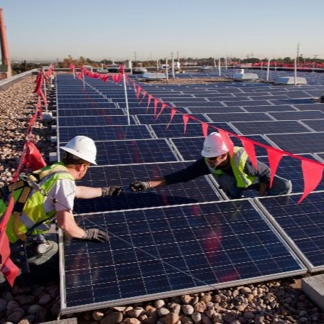 Men working on solar panels