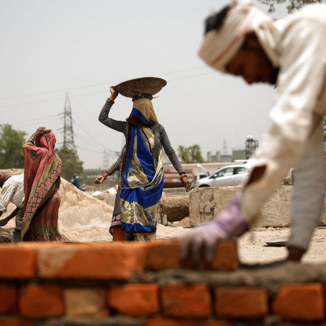 Brick layers during in a heatwave in New Delhi, India