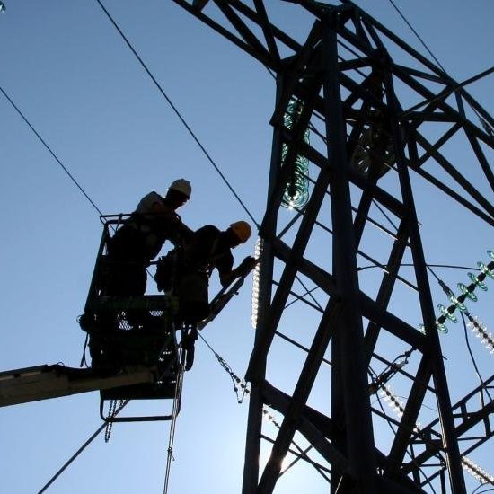 Workers working on electric powerlines 
