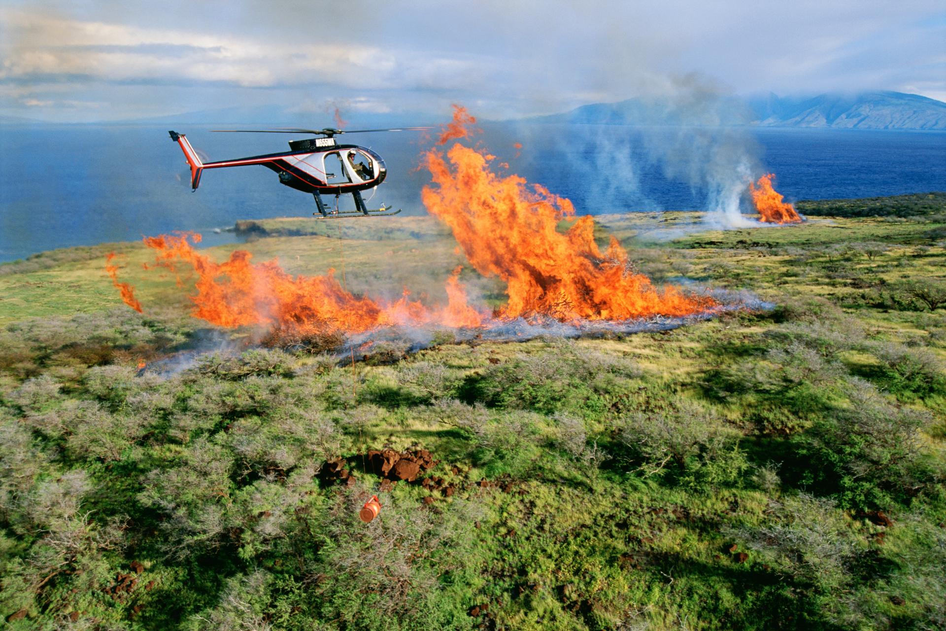 Helicopter flying over a fire